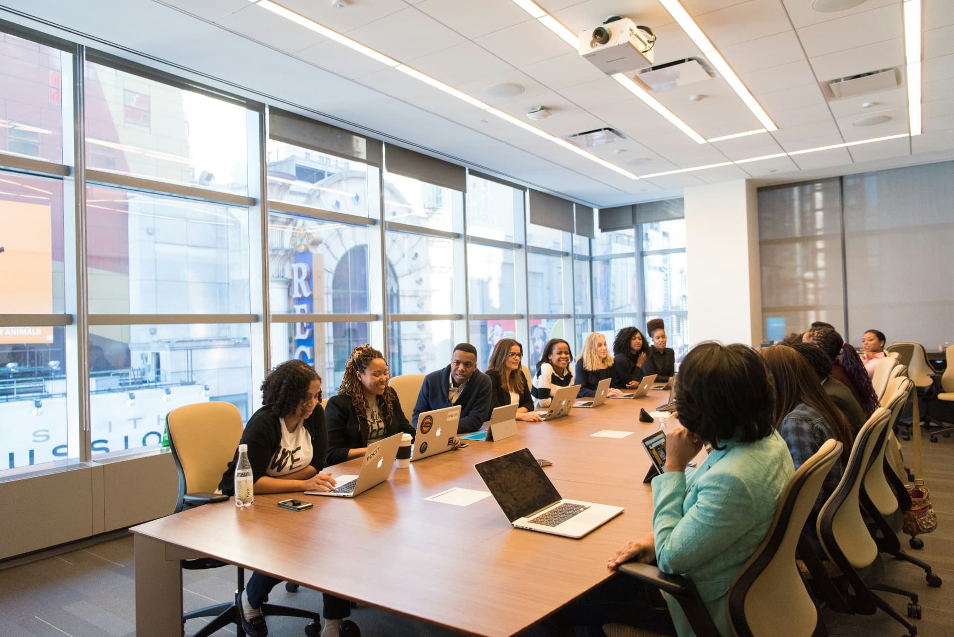 Professionals gathered around a conference table for a group meeting